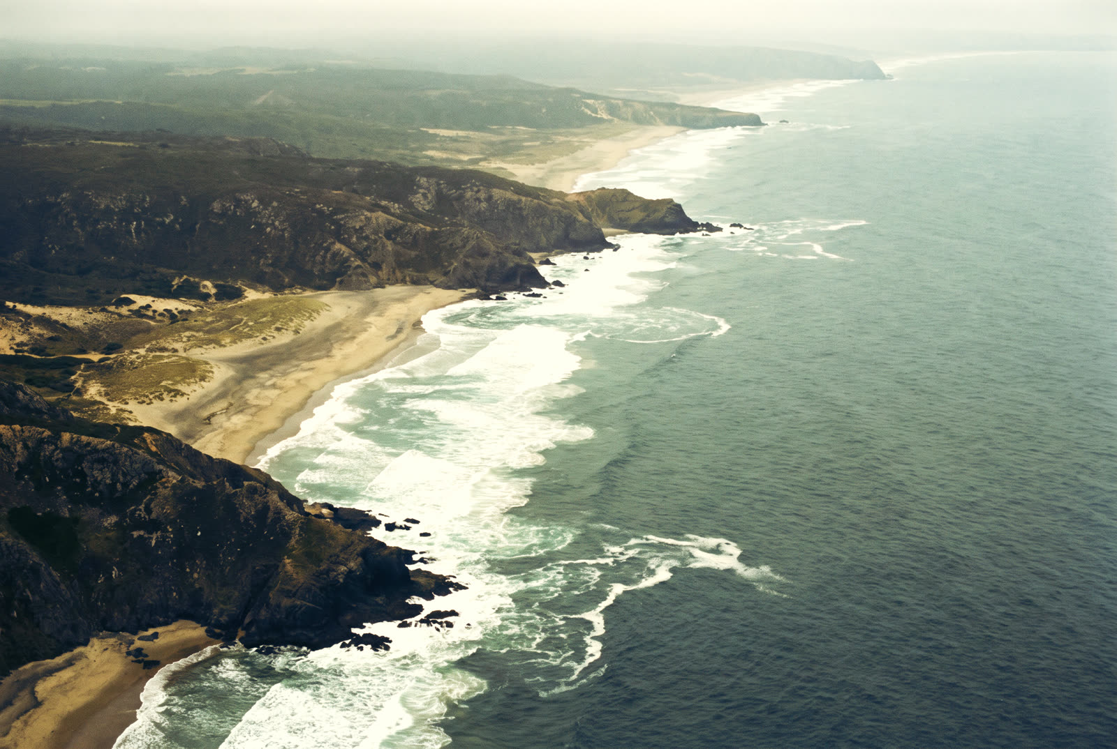 Aerial view of a coastline from a helicopter on a scenic flight